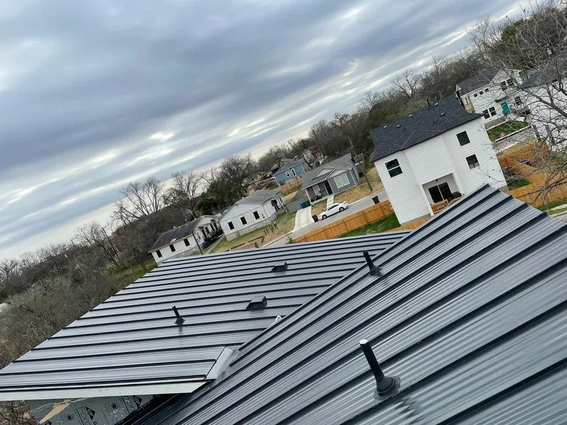 Standing seam metal roof panels with vents for Skylight Repair in Omaha